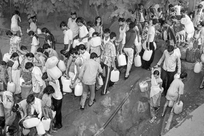 Status of Human Right to Water in Delhi - Water becomes everybody's business in the midst of the day in an unauthorized colony when, irrespective of age and gender, they scuttle to catch every drop of water that becomes available for a short while through a pipeline leakage nearby